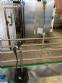 Llenadora rotativa gravim�trica de acero inoxidable con cabina