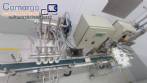 Llenadora lineal con 4 boquillas de rosca en acero inoxidable para botellas.