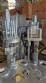 M�quina rotativa de acero inoxidable para llenado, dosificaci�n y sellado, con junta de aluminio, para tarros, vasos y botellas Delgo.
