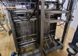 Envasadora vertical multicabezal Masipack 16 Twin con cinta transportadora y plataforma.